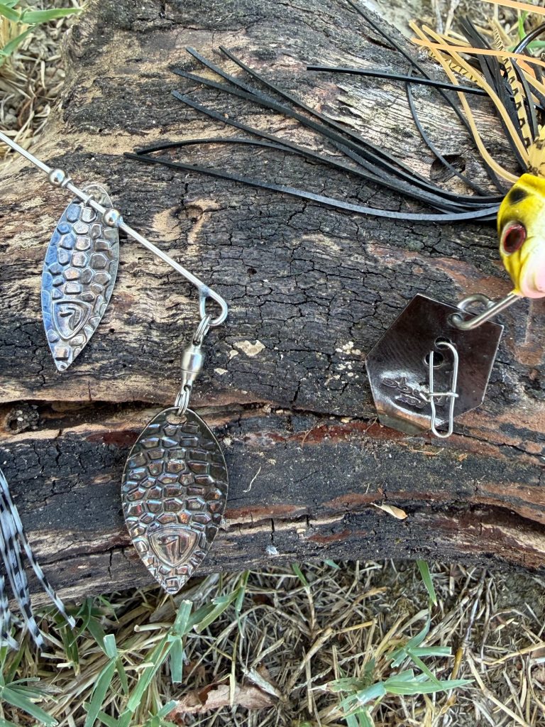 Close-up showing the blade difference between a chatterbait and spinnerbait
