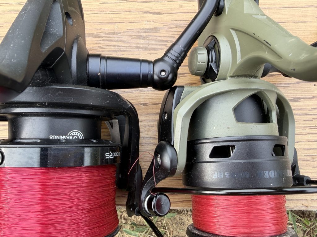 Close-up comparison of Sonik VaderX RS 8000 and Prologic Commander BF 6000S reels