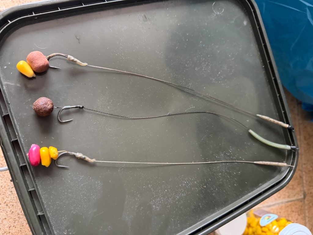 Three carp fishing hair rigs with boilie and corn hookbait presentations
